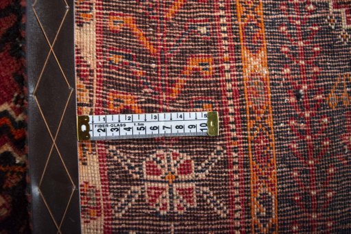 Surface texture of 2000s Ghashghai rug with natural Wool and intricate pattern