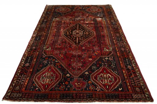 Surface texture of 2000s Ghashghai rug with natural Wool and intricate pattern
