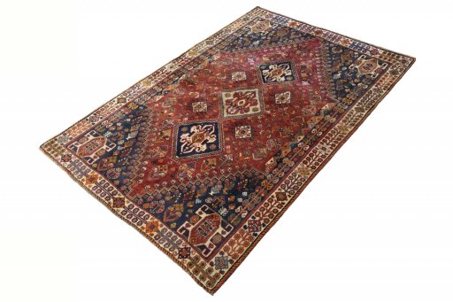 Corner detail of 2000s Ghashghai rug showing border pattern and Wool pile