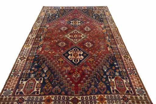 Surface texture of 2000s Ghashghai rug with natural Wool and intricate pattern