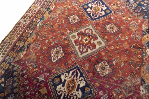 Backside of handmade 2000s Ghashghai rug showing knot structure and weave density
