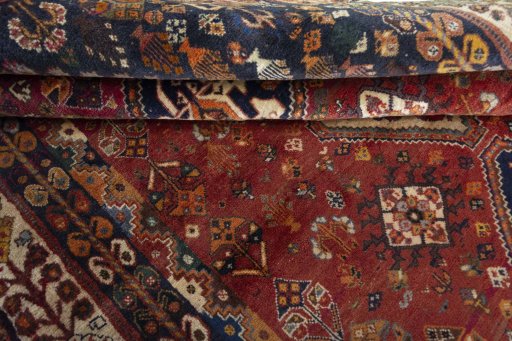 Full view of 2000s Ghashghai rug from Iran / Persia, 260 × 170 cm in Red tones