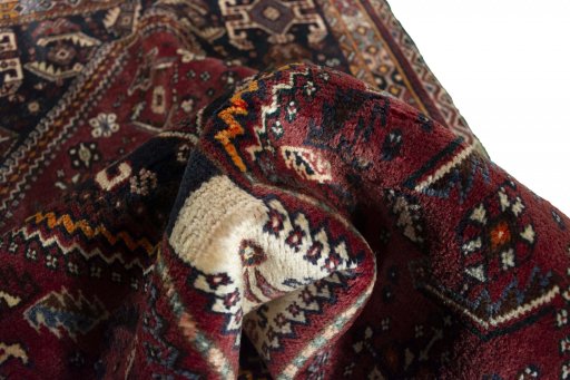 Corner detail of 2000s Ghashghai rug showing border pattern and Wool pile