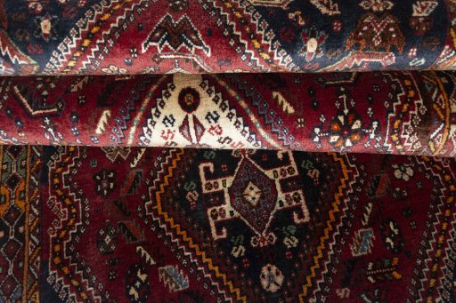 Full view of 2000s Ghashghai rug from Iran / Persia, 282 × 118 cm in Red tones
