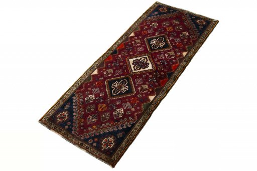 Corner detail of 2000s Ghashghai rug showing border pattern and Wool pile