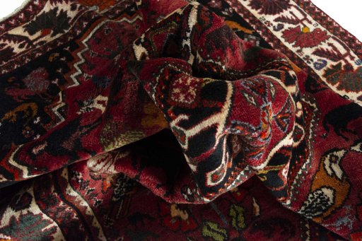 Corner detail of 2000s Ghashghai rug showing border pattern and Wool pile