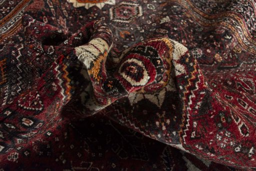 Corner detail of 2000s Ghashghai rug showing border pattern and Wool pile
