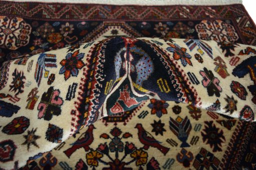 Surface texture of 2000s Ghashghai rug with natural Wool and intricate pattern
