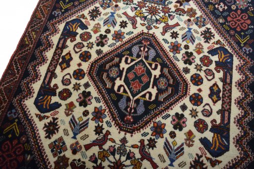 Backside of handmade 2000s Ghashghai rug showing knot structure and weave density