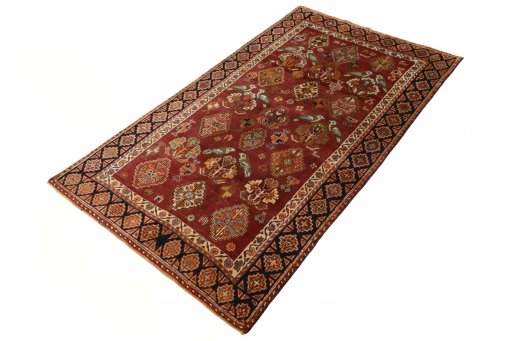 Corner detail of 2000s Ghashghai rug showing border pattern and Wool pile