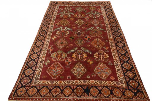 Surface texture of 2000s Ghashghai rug with natural Wool and intricate pattern