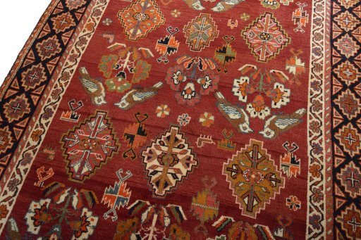 Backside of handmade 2000s Ghashghai rug showing knot structure and weave density
