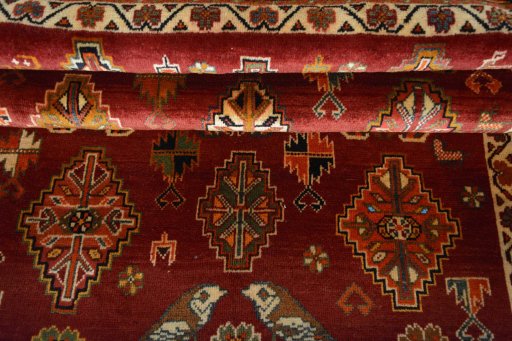 Full view of 2000s Ghashghai rug from Iran / Persia, 254 × 144 cm in Red tones