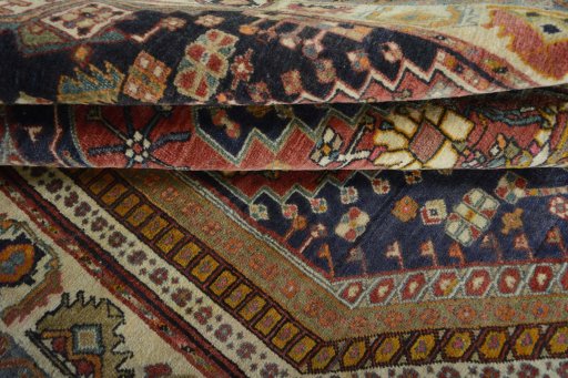Corner detail of 2000s Ghashghai rug showing border pattern and Wool pile
