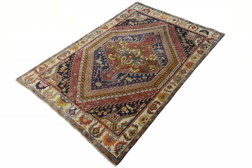 Corner detail of 2000s Ghashghai rug showing border pattern and Wool pile