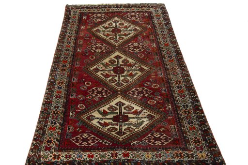 Surface texture of 1950s Ghashghai rug with natural Wool and intricate pattern
