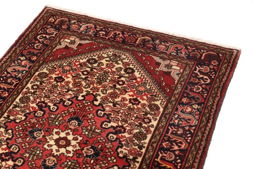 Backside of handmade 1940s Hamedan rug showing knot structure and weave density