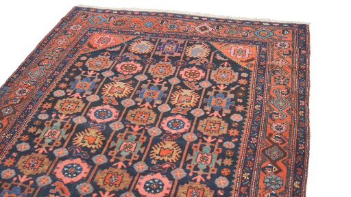 Surface texture of 1920s Hamedan rug with natural Wool and intricate pattern