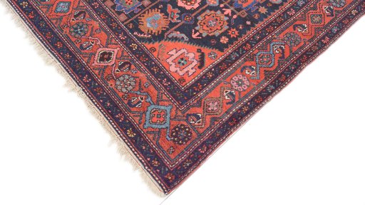 Backside of handmade 1920s Hamedan rug showing knot structure and weave density