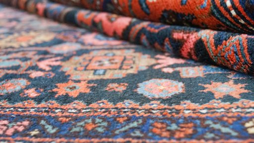 Close-up detail of 1920s Hamedan rug from Iran / Persia showing Wool weave