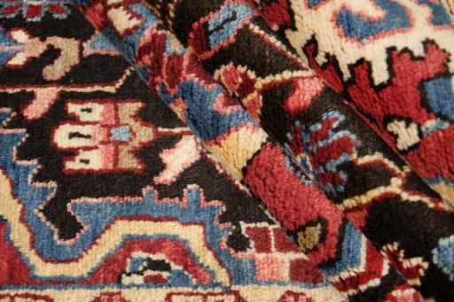 Corner detail of 1950s Hamedan rug showing border pattern and Wool pile