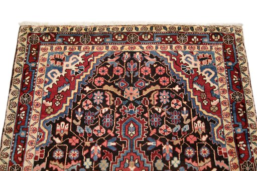 Surface texture of 1950s Hamedan rug with natural Wool and intricate pattern