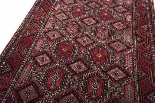 Backside of handmade 2000s Hamedan rug showing knot structure and weave density