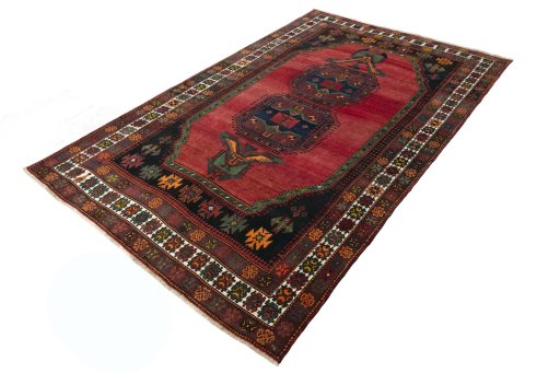Corner detail of 2000s Hamedan rug showing border pattern and Wool pile