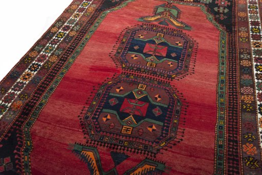 Backside of handmade 2000s Hamedan rug showing knot structure and weave density