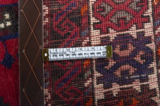 Backside of handmade 2000s Hamedan rug showing knot structure and weave density