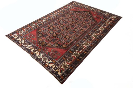 Corner detail of 2000s Hamedan rug showing border pattern and Wool pile