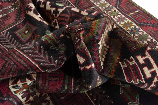 Corner detail of 2000s Hamedan rug showing border pattern and Wool pile