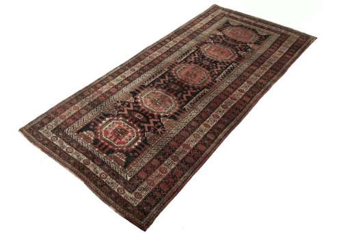 Corner detail of 2000s Hamedan rug showing border pattern and Wool pile