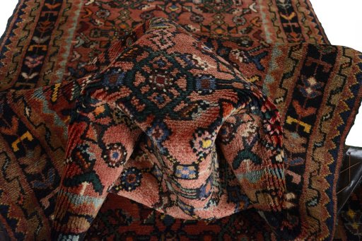 Corner detail of 2000s Hamedan rug showing border pattern and Wool pile