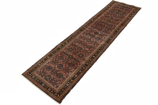 Corner detail of 2000s Hamedan rug showing border pattern and Wool pile