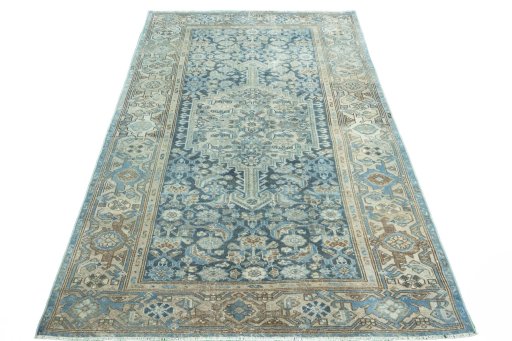 Surface texture of 1950s Hamedan rug with natural Wool and intricate pattern