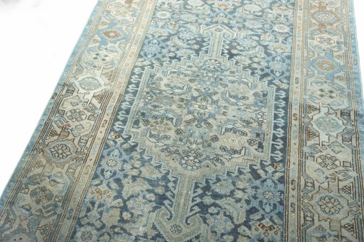 Backside of handmade 1950s Hamedan rug showing knot structure and weave density