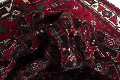 Corner detail of 2000s Hamedan rug showing border pattern and Wool pile
