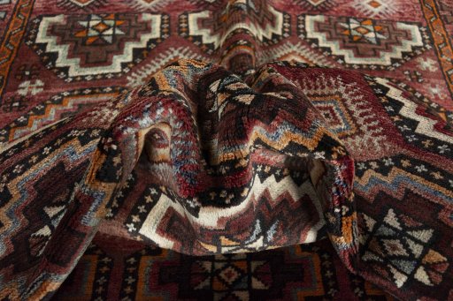 Corner detail of 2000s Hamedan rug showing border pattern and Wool pile