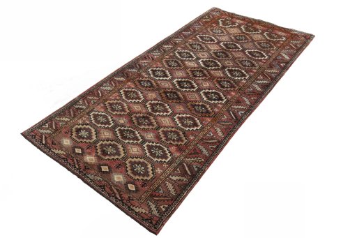 Corner detail of 2000s Hamedan rug showing border pattern and Wool pile