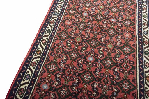 Backside of handmade New Hamedan rug showing knot structure and weave density