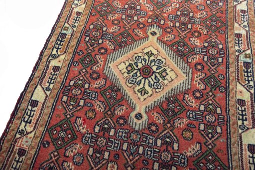 Backside of handmade 2000s Hamedan rug showing knot structure and weave density