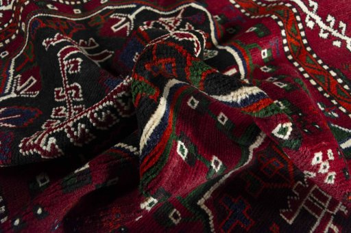 Corner detail of 2000s Hamedan rug showing border pattern and Wool pile