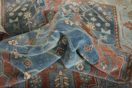 Surface texture of 1950s Hamedan rug with natural Wool and intricate pattern