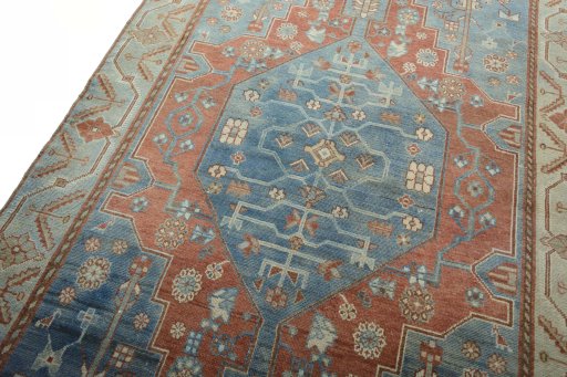 Backside of handmade 1950s Hamedan rug showing knot structure and weave density