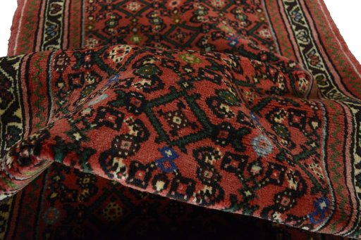 Corner detail of New Hamedan rug showing border pattern and Wool pile