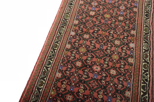 Backside of handmade New Hamedan rug showing knot structure and weave density
