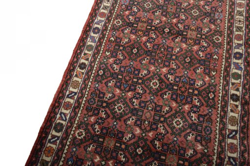 Backside of handmade New Hamedan rug showing knot structure and weave density