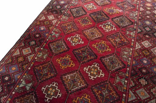 Backside of handmade 1970s Hamedan rug showing knot structure and weave density