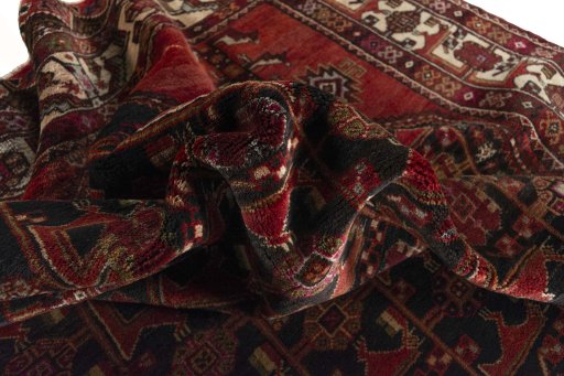 Corner detail of 1970s Hamedan rug showing border pattern and Wool pile